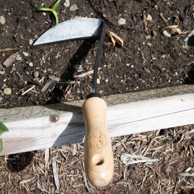 Handcrafted garden hand hoe with a smooth wooden handle and sturdy double-sided metal blade, designed for effective weed and grass removal in Farm, Garden & Tool, Garden Accessories, Best Sellers, Promo Eligible collections.