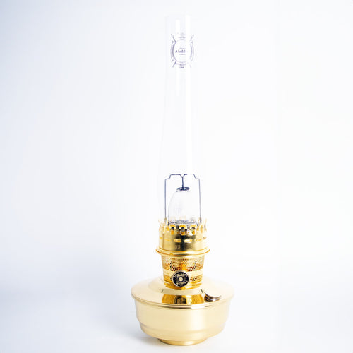 Handcrafted solid brass oil lamp with a tall glass chimney, designed for reliable lighting in farm, garden, and emergency settings, offering classic style and durability.