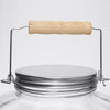 Close-up of a replacement butter churn jar lid with a metal screw-on top and wooden handle, crafted for specialty kitchen use in USA Made and Making Butter collections.