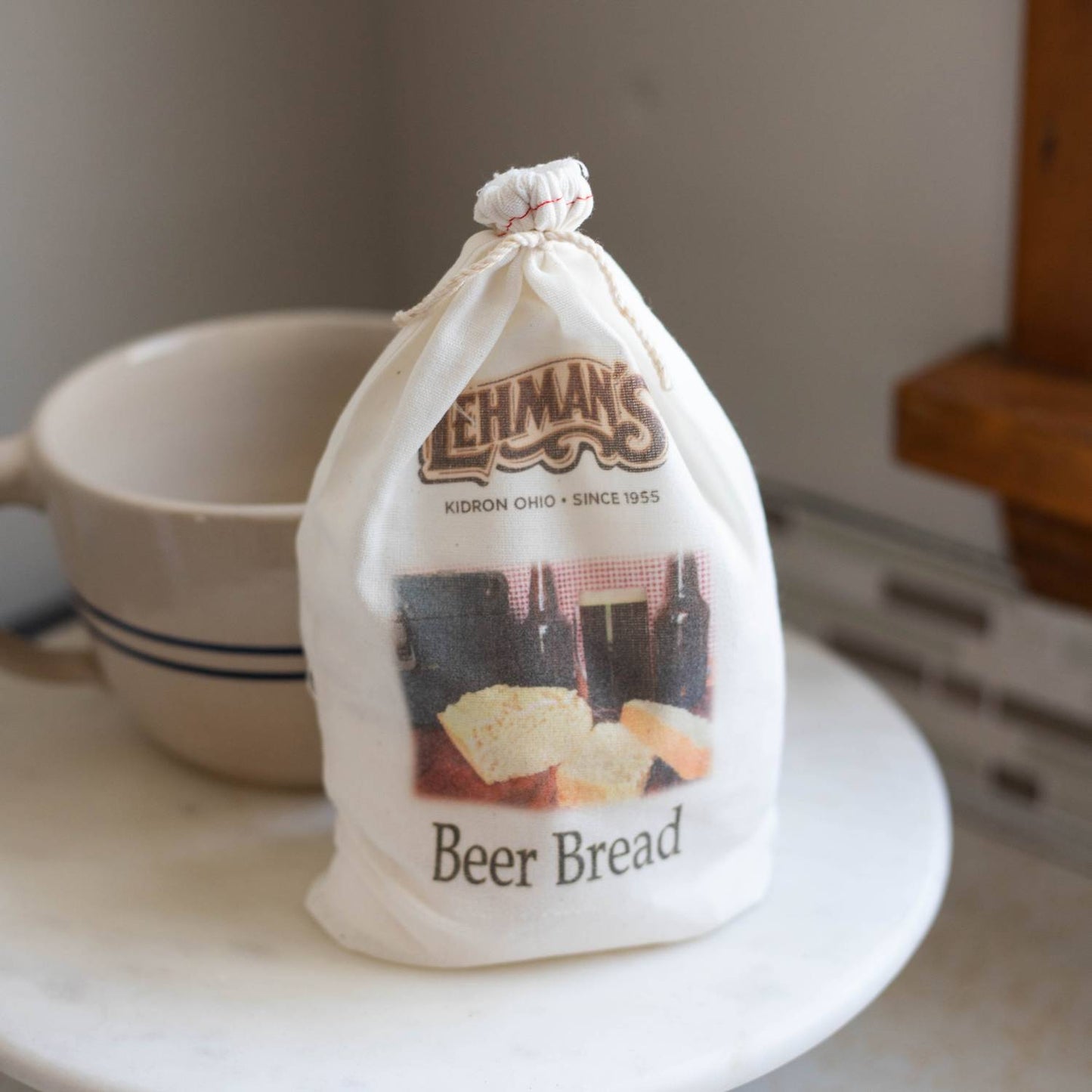Natural cotton drawstring bag holding handcrafted beer bread mix with rustic branding, perfect for Kitchen & Food, Pantry, Dry Goods and Mixes, Best Sellers, and Promo Eligible collections.