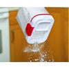 Clear plastic powdered sugar keeper with red accents sprinkling white sugar through a built-in shaker lid, designed for Kitchen & Food, Storage and Serving, and Best Sellers collections.