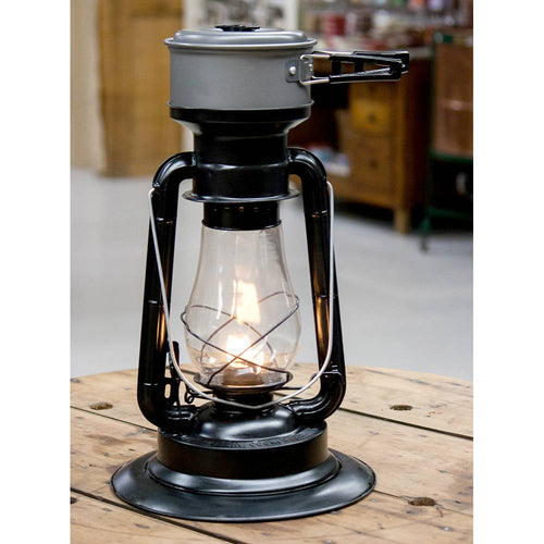 Handcrafted black powder-coated steel lantern with heat-resistant chimney and adjustable flame, designed for lighting, cooking, and heating in camping and emergency use.