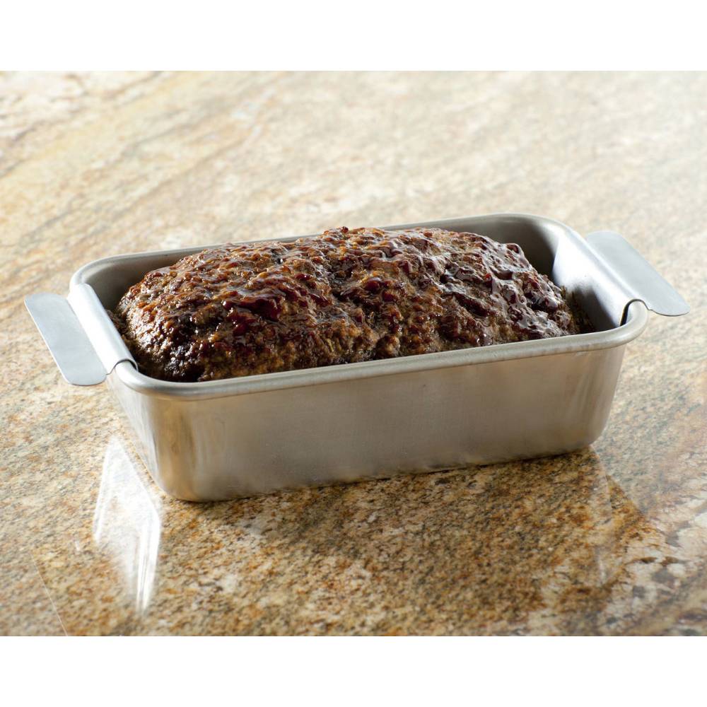 Roasted meatloaf resting in a rectangular aluminum pan with handles on a granite countertop, suited for Kitchen & Food, Cookware, and USA Made collections.
