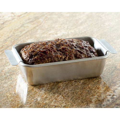 Roasted meatloaf resting in a rectangular aluminum pan with handles on a granite countertop, suited for Kitchen & Food, Cookware, and USA Made collections.