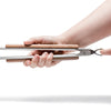 Hand holding brushed stainless steel BBQ tongs with wooden grips and a practical locking mechanism, ideal for grilling and outdoor cooking in Kitchen & Food and Camping collections.