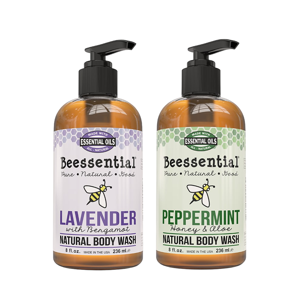 Two 8 fl oz amber pump bottles of Beessential natural body wash featuring lavender with bergamot and peppermint with honey and aloe scents, handcrafted and made in the USA, part of Health & Wellness, Soaps, USA Made, and Best Sellers collections.