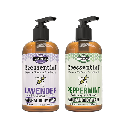 Two 8 fl oz amber pump bottles of Beessential natural body wash featuring lavender with bergamot and peppermint with honey and aloe scents, handcrafted and made in the USA, part of Health & Wellness, Soaps, USA Made, and Best Sellers collections.