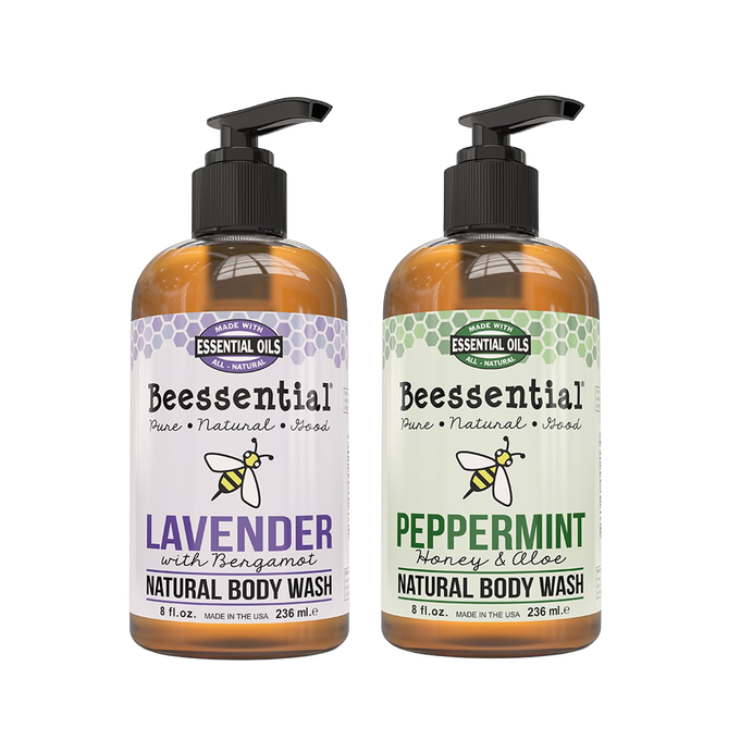 Two 8 fl oz amber pump bottles of Beessential natural body wash featuring lavender with bergamot and peppermint with honey and aloe scents, handcrafted and made in the USA, part of Health & Wellness, Soaps, USA Made, and Best Sellers collections.