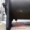 Close-up view of the lower section of a handcrafted Amish made, thick welded steel wood-fired water heater showing a 1-inch FIP tap located 4 inches behind the door, featured in Appliances, USA Made, and Water Heating and Treatment collections.