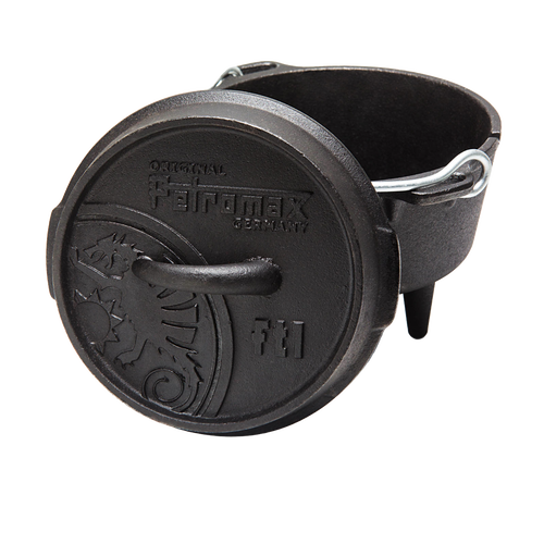 Heavy-duty cast iron Dutch oven with three legs and a sturdy metal bail handle, featuring an embossed lid with decorative details, designed for versatile outdoor and indoor cooking, ideal for Kitchen & Food, Cookware, Cast Iron, Best Sellers, and Promo Eligible collections.