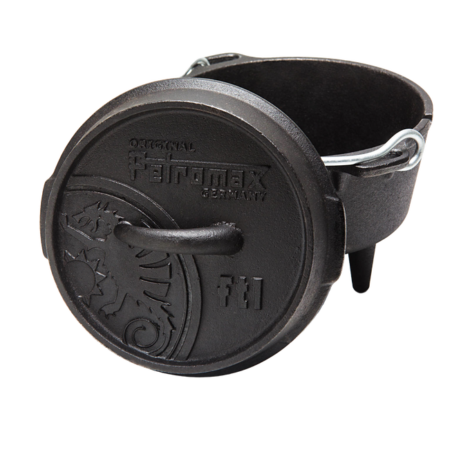 Heavy-duty cast iron Dutch oven with three legs and a sturdy metal bail handle, featuring an embossed lid with decorative details, designed for versatile outdoor and indoor cooking, ideal for Kitchen & Food, Cookware, Cast Iron, Best Sellers, and Promo Eligible collections.