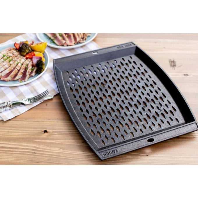 Handcrafted cast iron grill topper pan with signature teardrop perforations for enhanced grilling flavor, made in USA, featured in Kitchen & Food, Cookware, Cast Iron, and Best Sellers collections.