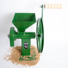 Green hand-crank grain mill with sturdy cast iron body and wooden handle, surrounded by whole grains, ideal for kitchen, farm, and emergency food supplies.