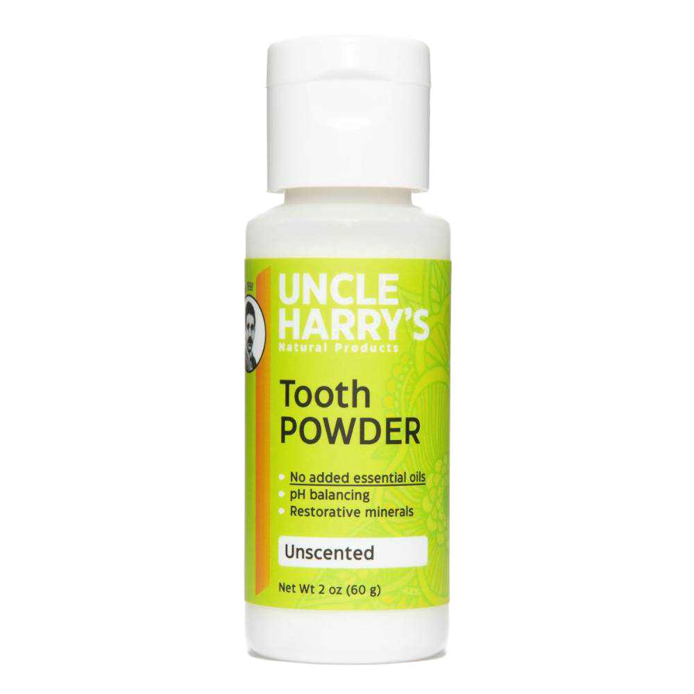 White plastic bottle of natural tooth powder featuring bright green label with product benefits including pH balancing and restorative minerals, handcrafted and made in USA, ideal for Health & Wellness and Grooming collections.