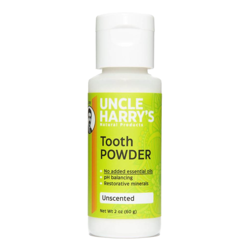 White plastic bottle of natural tooth powder featuring bright green label with product benefits including pH balancing and restorative minerals, handcrafted and made in USA, ideal for Health & Wellness and Grooming collections.
