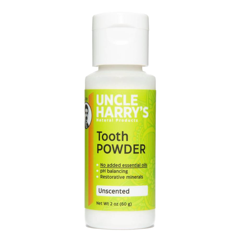 White plastic bottle of natural tooth powder featuring bright green label with product benefits including pH balancing and restorative minerals, handcrafted and made in USA, ideal for Health & Wellness and Grooming collections.