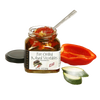 Open jar of fire-grilled mixed vegetables with spoon inside, accompanied by sliced zucchini and halved red bell pepper, perfect for Kitchen & Food and Pantry collections.