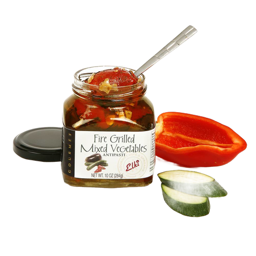 Open jar of fire-grilled mixed vegetables with spoon inside, accompanied by sliced zucchini and halved red bell pepper, perfect for Kitchen & Food and Pantry collections.