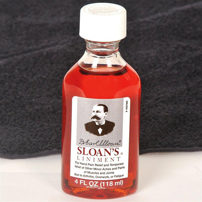 Handcrafted glass bottle of reddish liniment for hand and muscle pain relief, made in USA, featured in Health & Wellness, Health Remedies, Best Sellers, and Promo Eligible collections.
