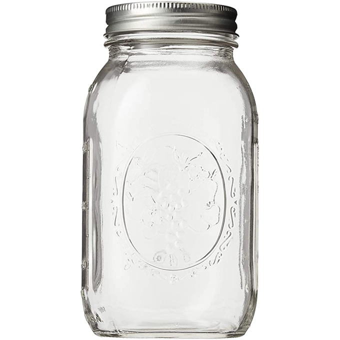 Clear glass regular-mouth canning jar with metal lid featuring embossed vintage fruit design, ideal for Kitchen & Food, Food Preservation, Canning, USA Made, and Best Sellers collections.