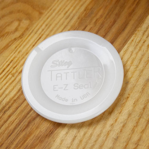 Close-up of a handcrafted, white reusable canning jar lid made in the USA, designed for regular mouth jars, featured in Kitchen & Food, Food Preservation, and Canning collections.