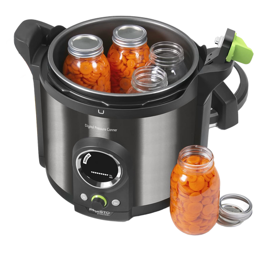 Electric 12-quart stainless steel digital pressure canner with black handles and green accent on lid, shown with glass jars of preserved sliced carrots, ideal for food preservation in kitchen and canning collections.