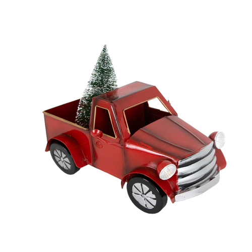 Red metal vintage-style truck decoration with a small green Christmas tree in the bed, featuring battery-operated lights, perfect for holiday decor and home accents.