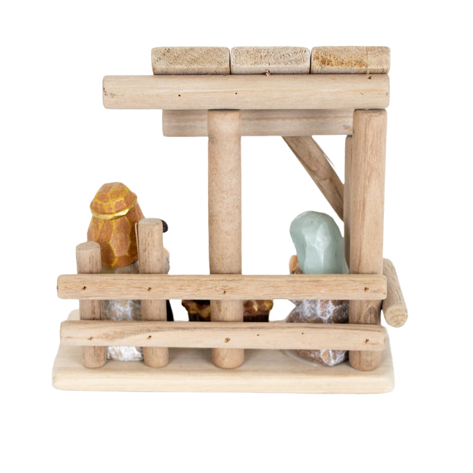 Handcrafted small nativity display with a simple wooden stable and attached resin figurines of Mary, Joseph, and baby Jesus, designed for Home & Decor and Holiday Decor collections.