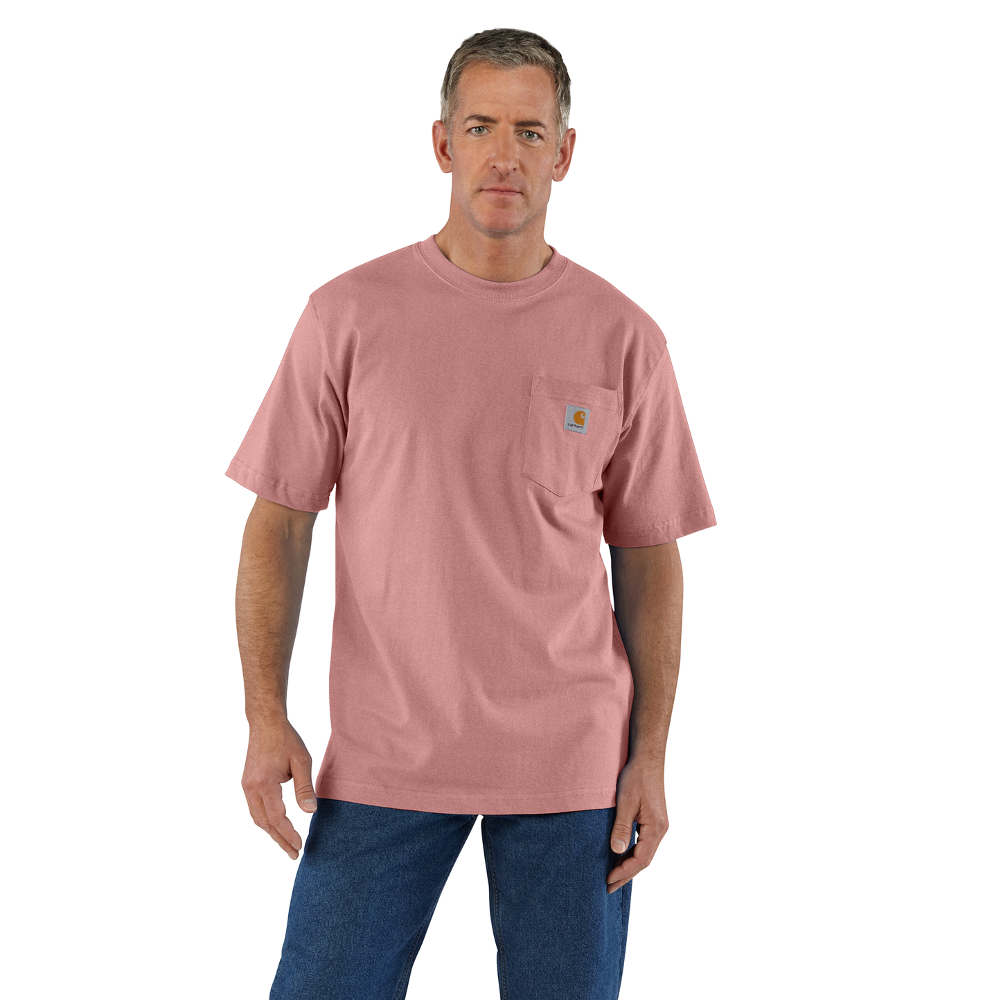 Man wearing a durable, heavyweight pink cotton pocket t-shirt with rib-knit crewneck and loose fit, styled with blue jeans, featured in Clothing and Accessories and Best Sellers collections.