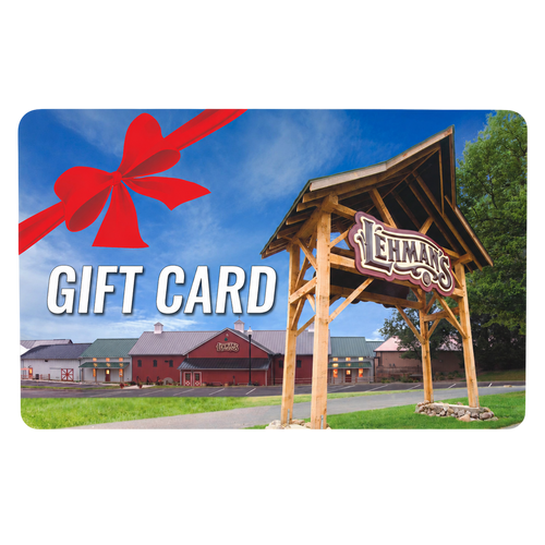Lehman's store entrance with a large wooden sign under a blue sky, overlaid with bold white text reading Gift Card and a festive red ribbon bow, featured in Best Sellers.