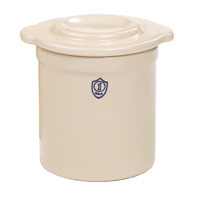 Cream-colored stoneware crock lid with raised center, handcrafted in the USA, designed for food preservation and fermenting in kitchen and pickling collections.