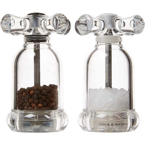 Clear acrylic salt and pepper mills resembling vintage faucet handles, filled with fine peppercorns and coarse sea salt, suited for Kitchen & Food, Dinnerware, Storage and Serving, Best Sellers, and Promo Eligible collections.