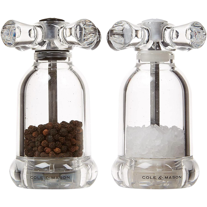 Clear acrylic salt and pepper mills resembling vintage faucet handles, filled with fine peppercorns and coarse sea salt, suited for Kitchen & Food, Dinnerware, Storage and Serving, Best Sellers, and Promo Eligible collections.