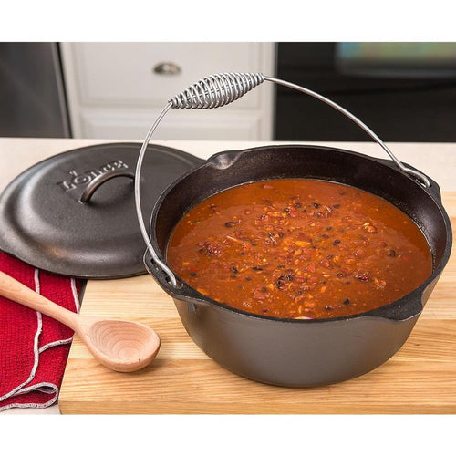 Pre-seasoned black cast iron Dutch oven with spiral bail handle and self-basting lid removed, filled with rich homemade chili, ideal for Kitchen & Food, Cookware, Cast Iron, USA Made, Best Sellers, Promo Eligible collections.