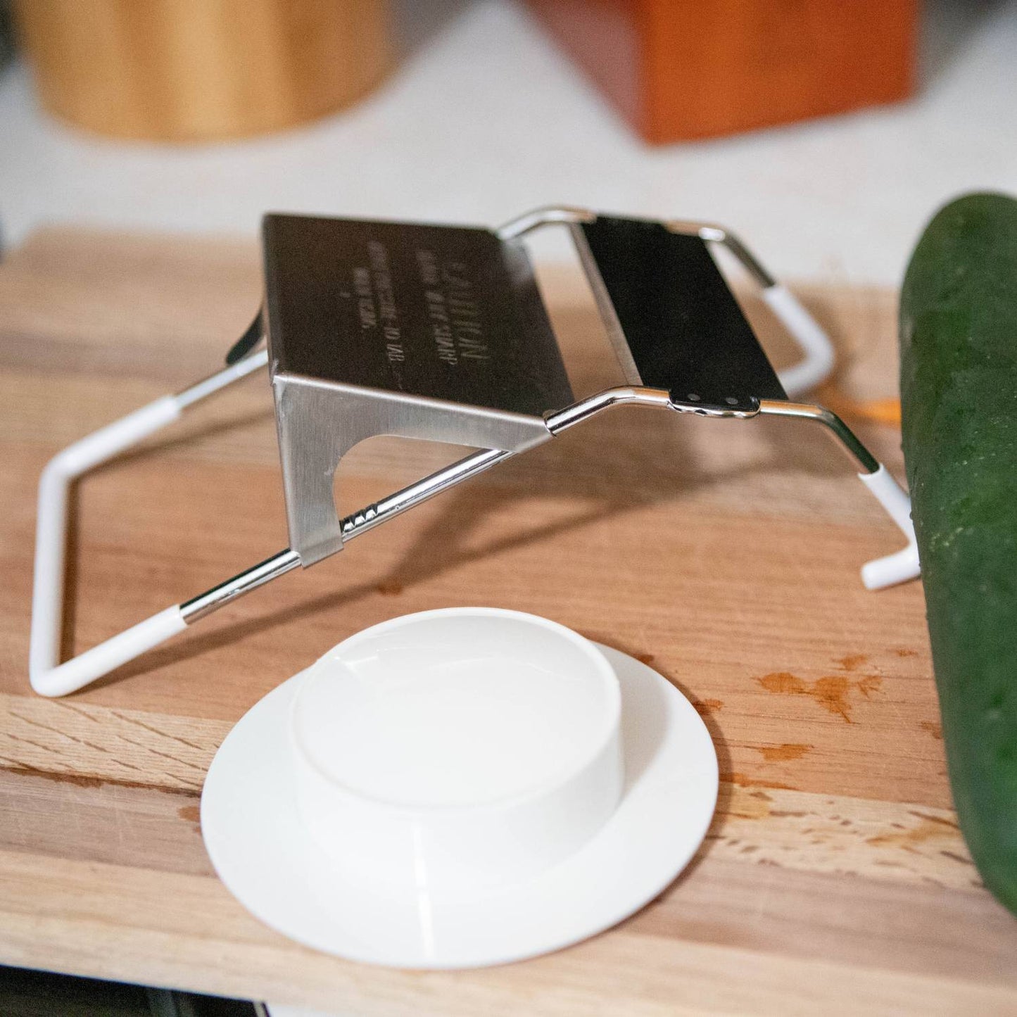 Handcrafted vegetable slicer with stainless steel blade and white frame, designed for uniform cuts between 1/8" to 1/2" thick, ideal for Kitchen & Food, Food Prep, Choppers and Cutters, Best Sellers, and Promo Eligible collections.