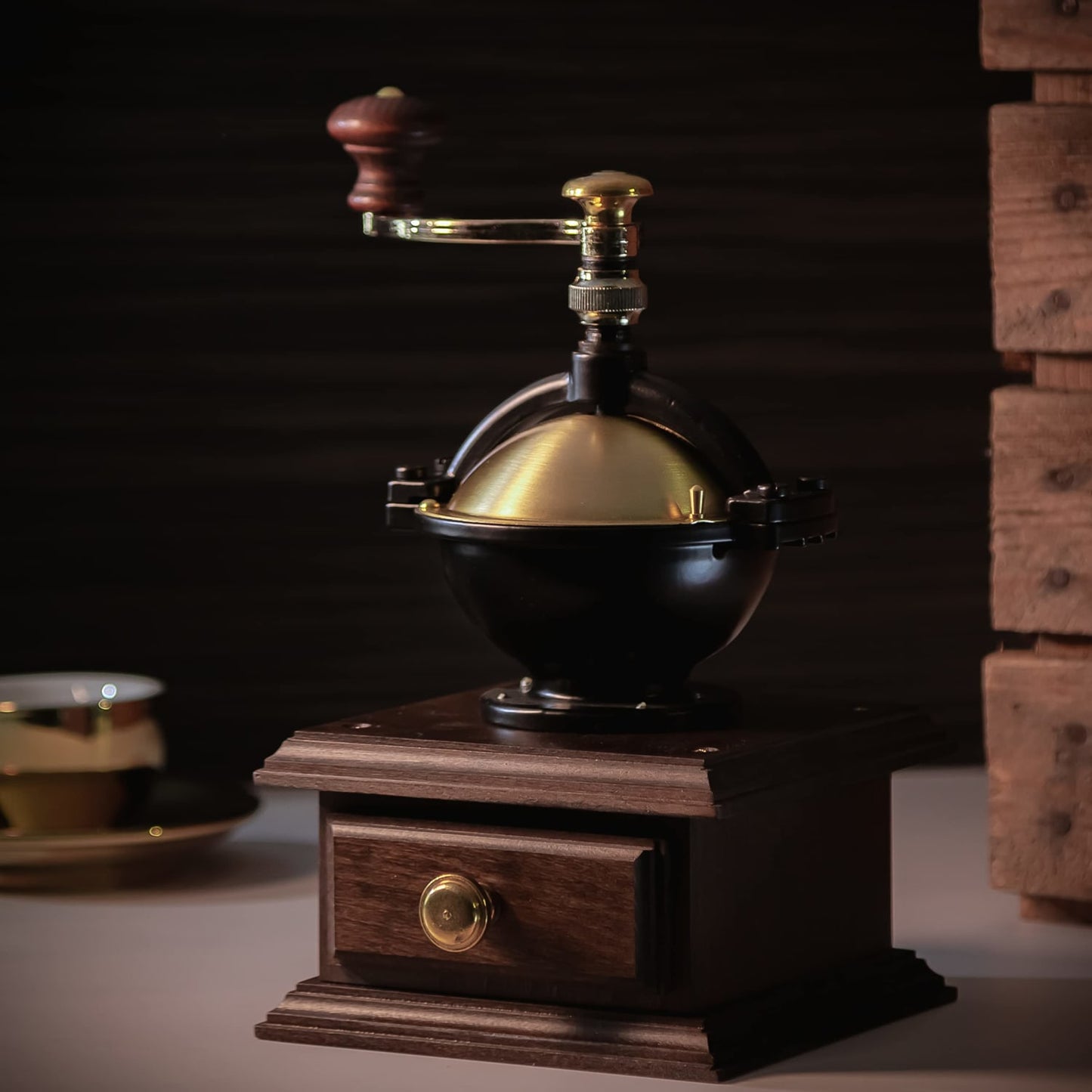 Handcrafted German top-crank coffee mill with polished brass and wooden accents, designed for efficient grinding, featured in Farm, Garden & Tool, Kitchen & Food, Brewing Coffee and Tea, and Best Sellers collections.