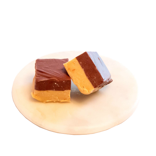 Two handcrafted layered fudge pieces with creamy chocolate and caramel tones on a white plate, featured in Kitchen & Food, Food, Snacks and Sweets, USA Made, Best Sellers, and Promo Eligible collections.