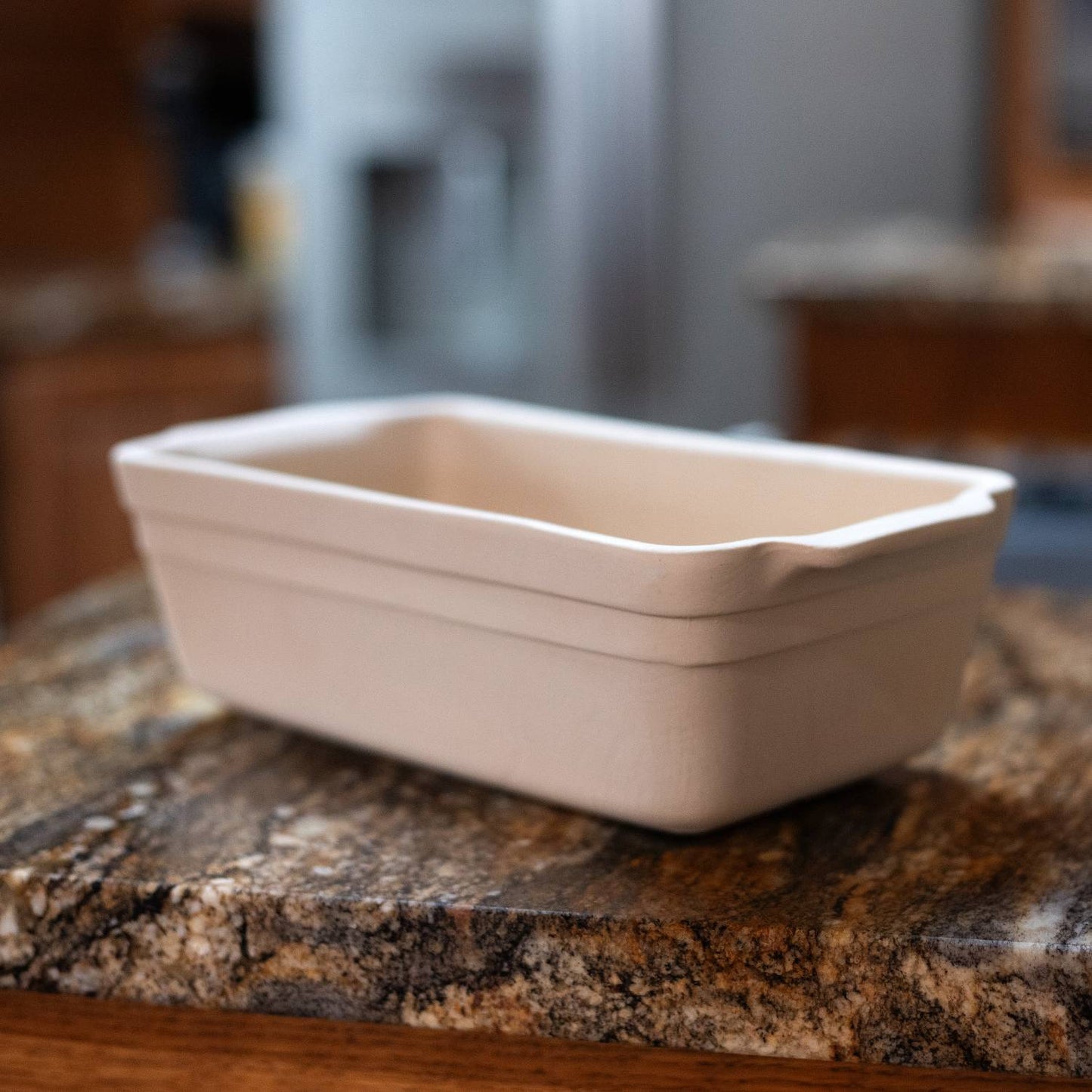 Handcrafted natural stoneware loaf pan in light beige with durable vitrified clay construction, made in USA, ideal for Kitchen & Food, Cookware, Pots and Pans, Bread Making Supplies, and Best Sellers collections.