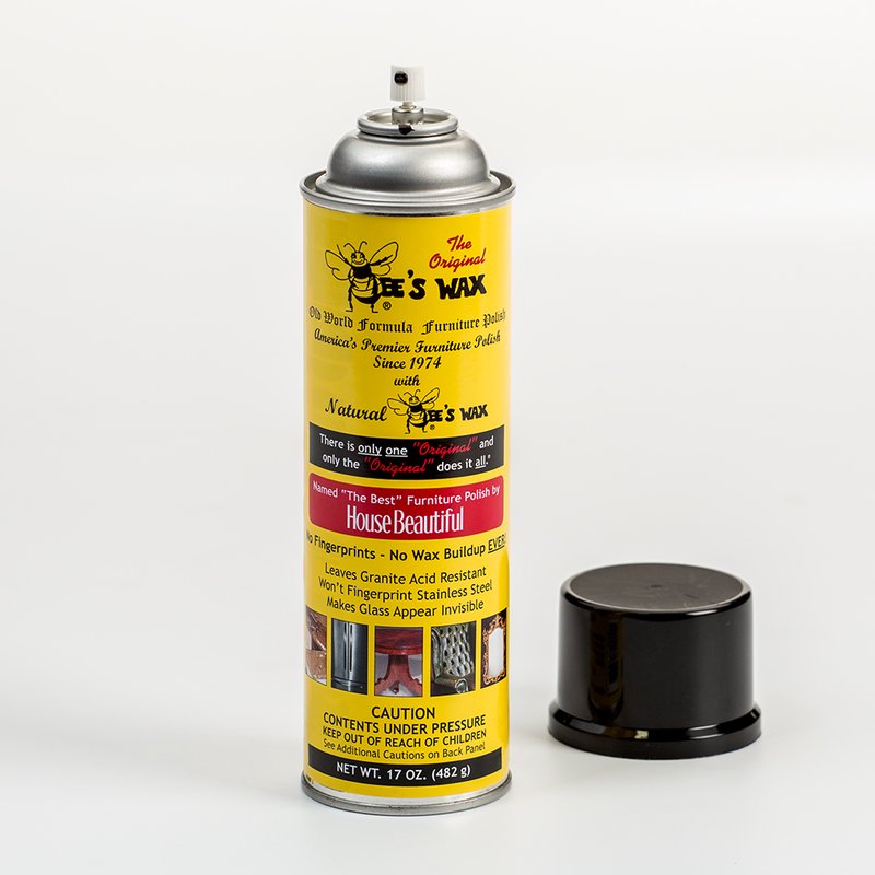 Yellow spray can of Bee's Wax furniture polish with black cap removed, featuring vintage-style text and images promoting no wax buildup, fingerprint resistance, and granite protection, ideal for Home & Decor, Household Cleaning, Cleaners and Polishes, USA Made, Best Sellers, and Promo Eligible collections.