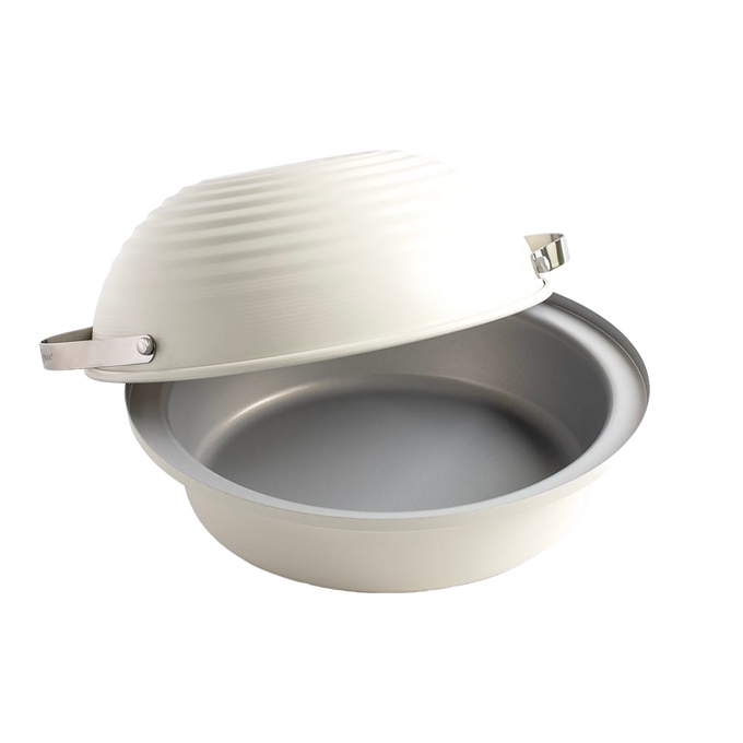 Cream-colored round baking cloche with a hinged domed lid and metal clasp, designed for home bread making and included in Kitchen & Food and Baking Supplies collections.