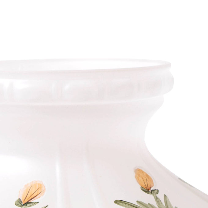 Handcrafted glass oil lamp shade with delicate buttercup flower design on frosted white glass, suitable for lamps with 10-inch shade rings in lighting and accessory collections.