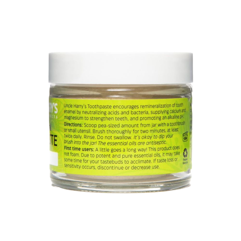 Handcrafted glass jar of all-natural alkalizing toothpaste with white lid and bright yellow label featuring usage instructions, ideal for Health & Wellness, Grooming and Personal Hygiene, USA Made, and Best Sellers collections.
