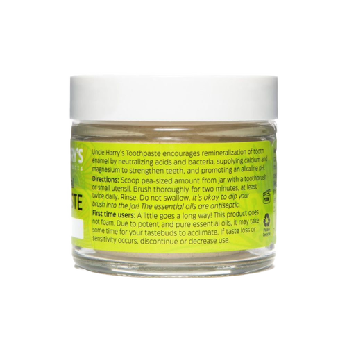 Handcrafted glass jar of all-natural alkalizing toothpaste with white lid and bright yellow label featuring usage instructions, ideal for Health & Wellness, Grooming and Personal Hygiene, USA Made, and Best Sellers collections.