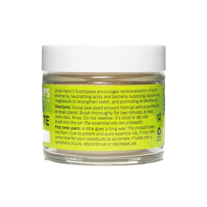 Handcrafted glass jar of all-natural alkalizing toothpaste with white lid and bright yellow label featuring usage instructions, ideal for Health & Wellness, Grooming and Personal Hygiene, USA Made, and Best Sellers collections.