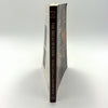 Spine view of The Bread Builders book focusing on natural bread baking in masonry ovens, ideal for Cookbooks, Bread Making Supplies, and Best Sellers collections.