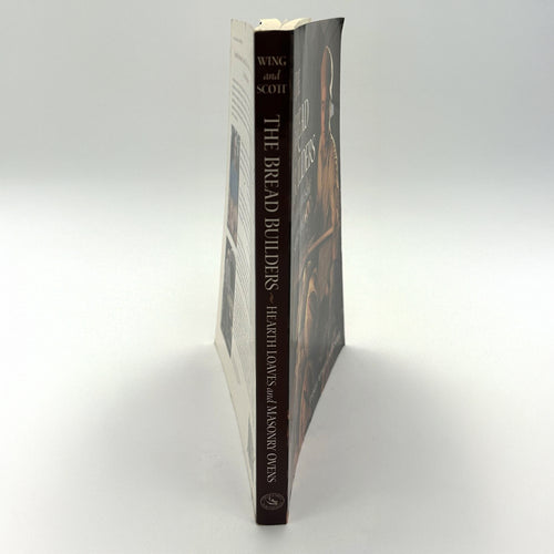 Spine view of The Bread Builders book focusing on natural bread baking in masonry ovens, ideal for Cookbooks, Bread Making Supplies, and Best Sellers collections.