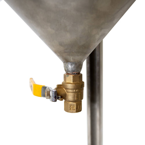 Close-up view of rust-proof brass valve with yellow handle attached to a handcrafted stainless steel cream separator, part of Farm, Garden & Tool and USA Made collections.