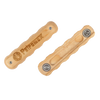 Pair of light wooden handles with ergonomic grooves and metal attachments, engraved with a logo, designed for easy mounting on wrought iron pans, ideal for kitchen, camping, and cookware collections.