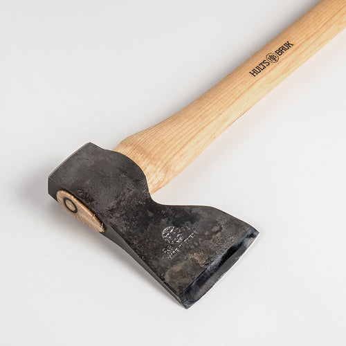 Handcrafted carpenter axe with a narrow, razor-sharp forged steel head and smooth wooden handle, designed for precision woodworking in farm, garden, and hardware tool collections.