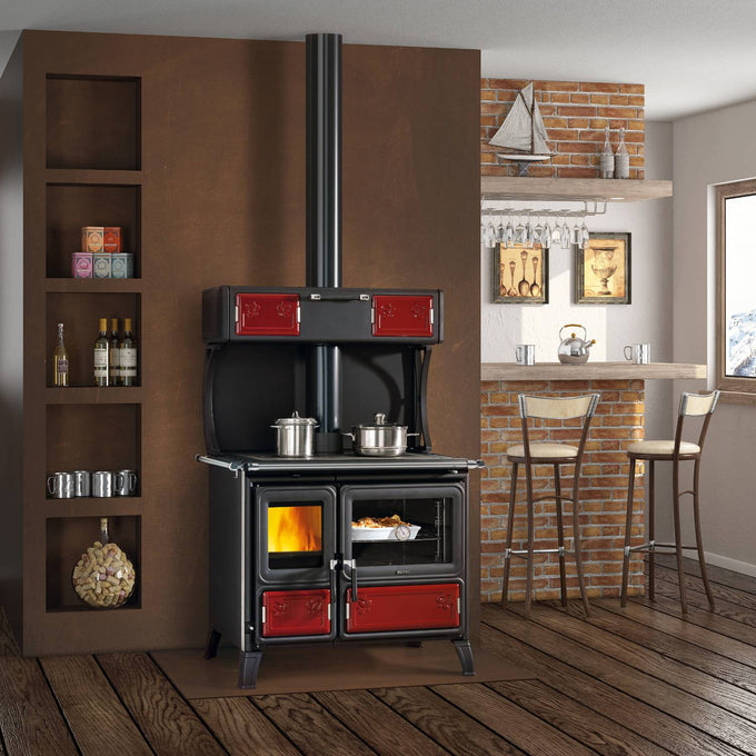 Handcrafted wood-burning cook stove with cast iron fire door and vibrant red enamel panels, featuring optional top food warmer, legs for easy cleaning, and external air intake, ideal for Stoves, Cookstoves, Best Sellers, and All Stoves & Appliances collections.